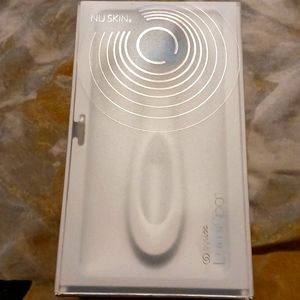 LumiSpa completely new in its white and blue box, comes with its charger